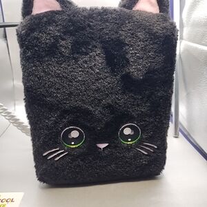 Na! Na! Na! Surprise Backpack Bedroom Case, modeled after a black kitty cat Back